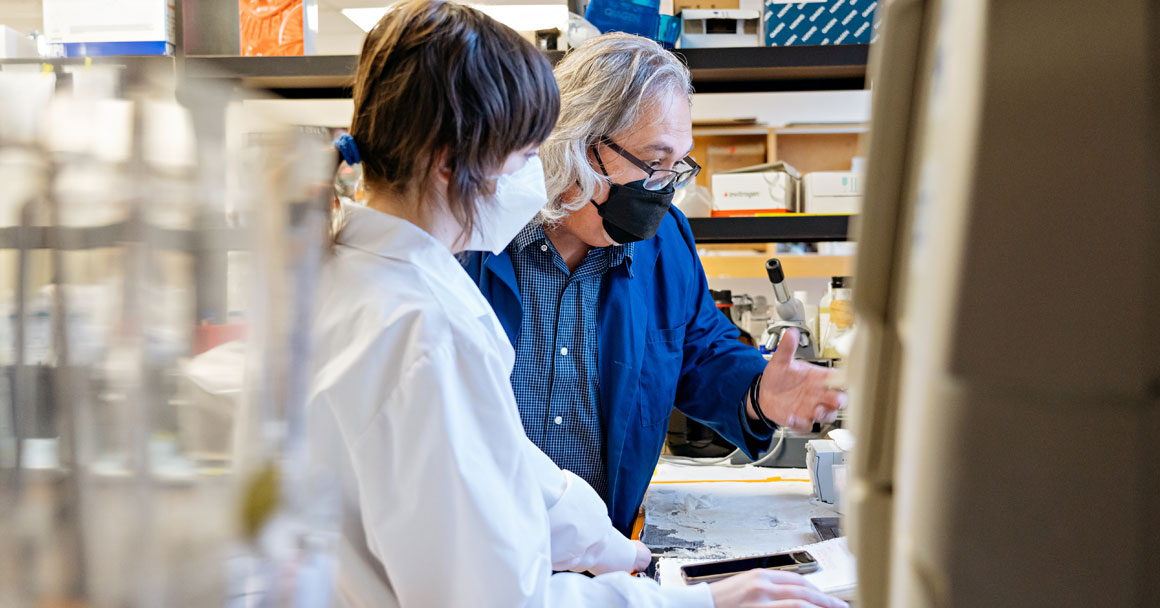 Dr. Glen Pyle with a research assistant in his lab