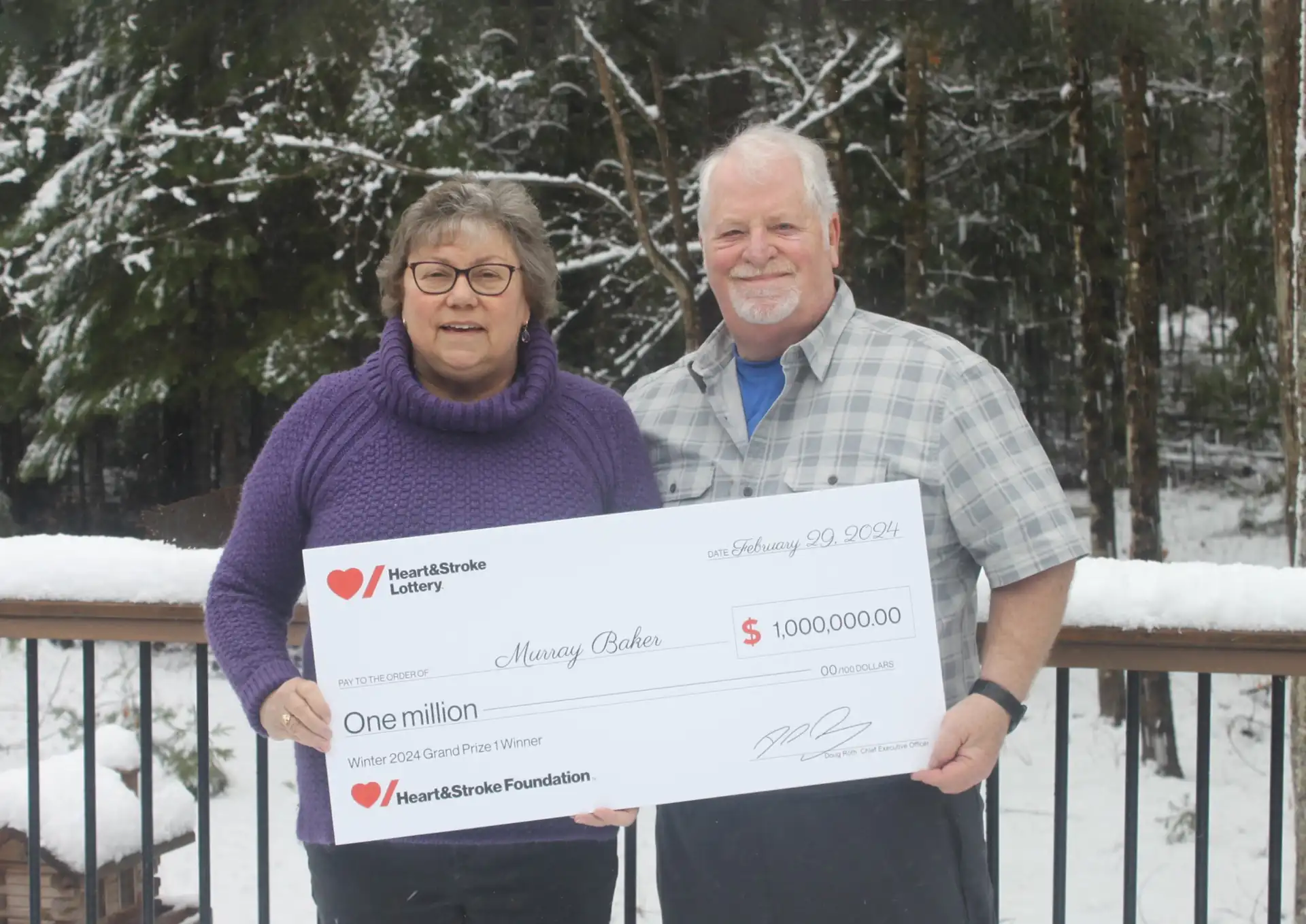 Murray Baker holding a cheque