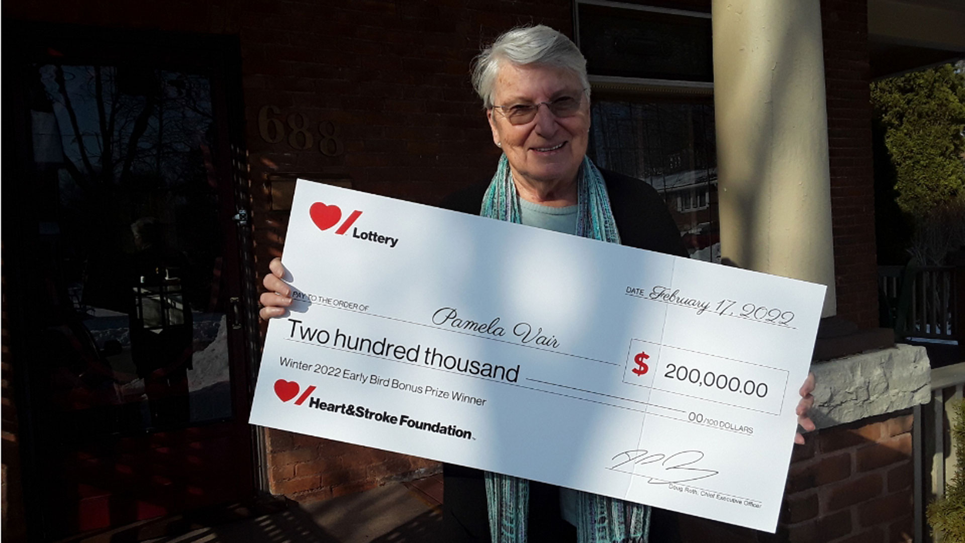 Pamela Vair holding the cheque