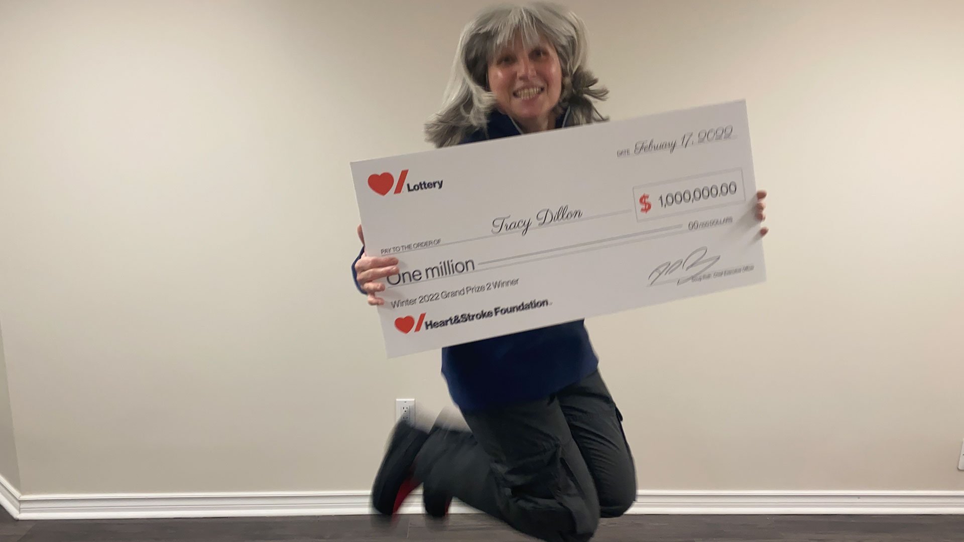 Tracy Dillon holding the novelty cheque