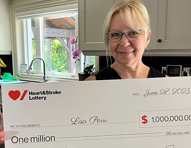 Grand Prize lottery winner Lisa Perri holds a cheque for $1,000,000