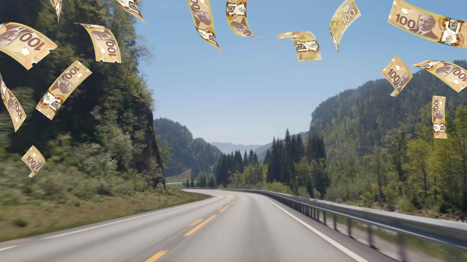 An image of the open road with money floating around