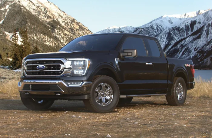 A black Ford F-150 Lariat truck