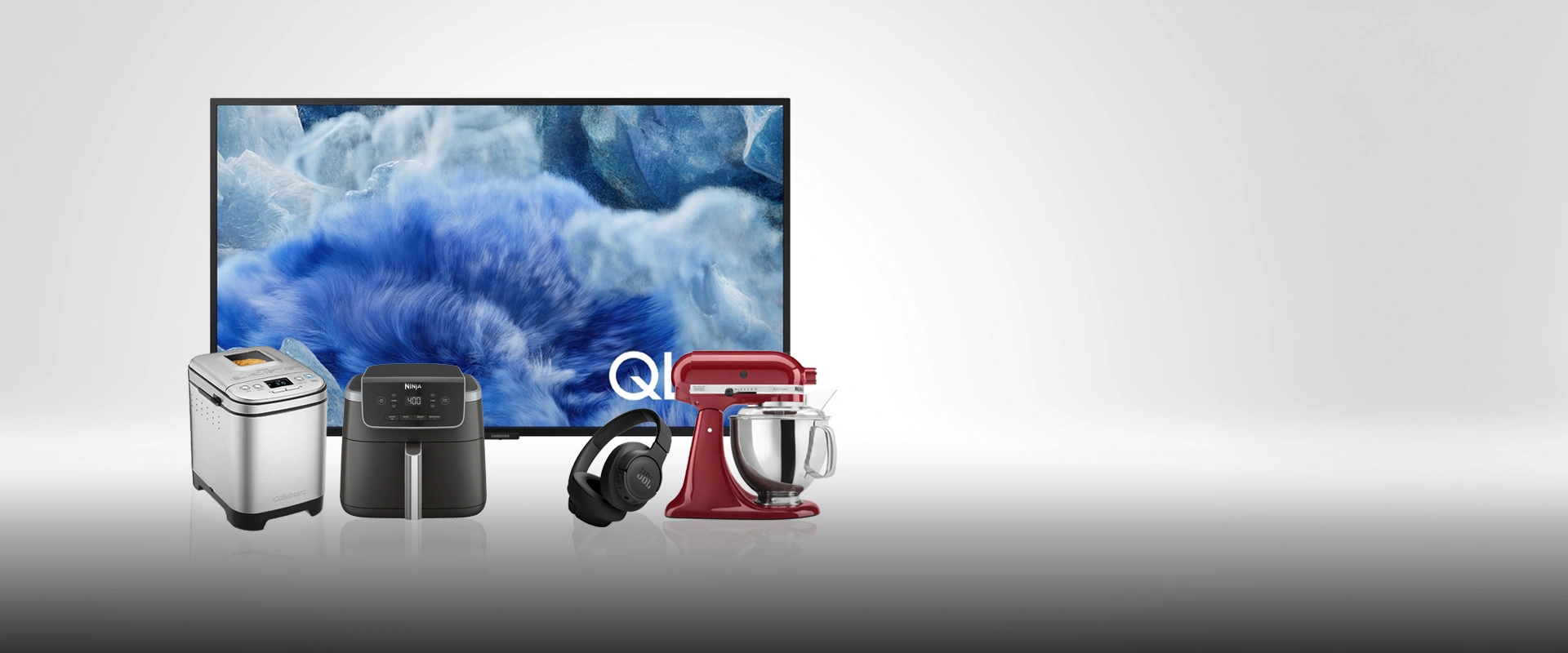 Showcasing a Samsung 65" Smart QLED 4K TV, a KitchenAid 5-Qt. Tilt-Head Stand Mixer, a Cuisinart CBK-110C Compact Automatic Bread Maker, Ninja Air Fryer Pro 4in1, and aJBL Tune 720BT Wireless Over-Ear Headphones     