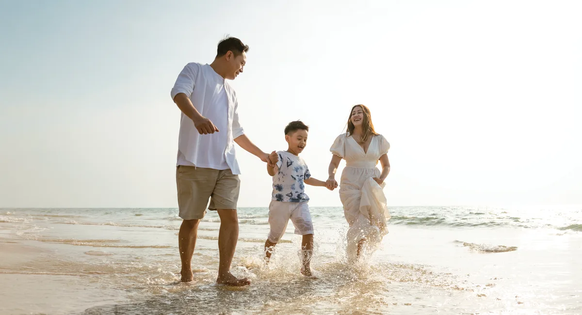 Family enjoying their time together on a beach.